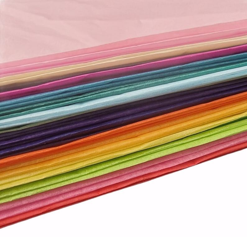 May include: A stack of colorful tissue paper in various shades of pink, cream, purple, blue, green, orange, yellow, and red.