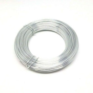May include: A coil of silver-colored wire, perfect for crafting projects.