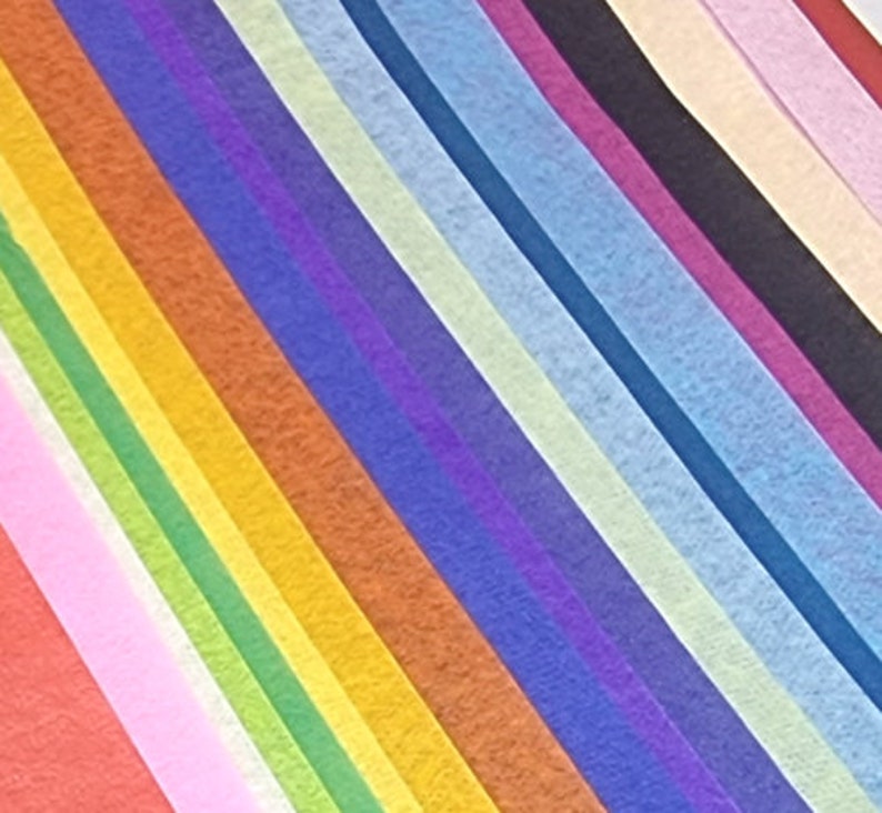 May include: A collection of tissue paper in various colors, including red, orange, yellow, green, blue, purple, pink, and white. The tissue paper is arranged in a diagonal pattern.
