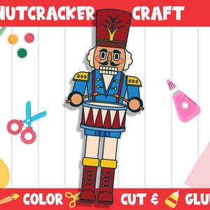 May include: A printable craft template of a nutcracker soldier playing a drum. The template is ready to be colored, cut out, and glued together. The image includes paintbrushes, paint, scissors, and glue.