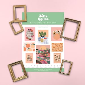 May include: A sheet of paper with multiple printed illustrations for a dollhouse gallery wall, featuring floral, landscape, and text designs, surrounded by five empty gold-coloured miniature frames and a ruler measuring up to 15 centimetres.