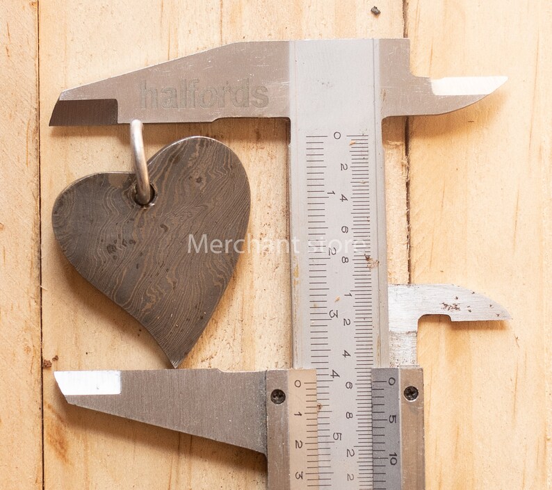 Hand forged heart pendant handmade heart necklace beautiful gift for your lover. Damascus steel love locket