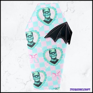 Cartera plegable con solapa y alas de murciélago de Frankenstein de Coquette
