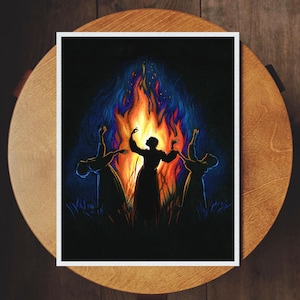 May include: Three figures in silhouette stand around a large fire, their arms raised in a circle. The fire is bright orange and yellow, with blue and purple smoke rising above it. The background is dark.