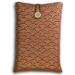 May include: A rectangular, burgundy fabric book sleeve with a repeating gold wave pattern. The sleeve has a wooden button closure with a floral design and a black elastic loop. The overall design is inspired by Japanese art.