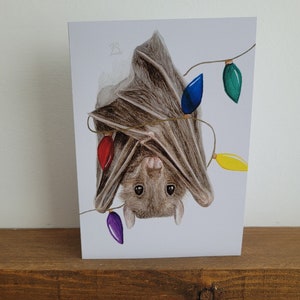 Carte festive de chauve-souris frugivores, carte de chauve-souris de Noël, carte de chauve-souris frugivores, carte de Noël effrayante, carte pour les amateurs de chauves-souris, carte de Noël animal