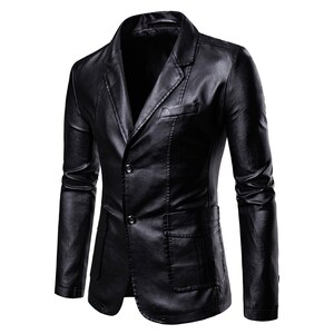 May include: A black leather blazer with a notched lapel, two-button closure, and two front pockets. The jacket has a classic design and a tailored fit. The blazer is made of a smooth, shiny material.