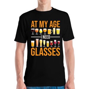 Funny At My Age I Need Glasses Cool Cocktail Beer Glass Drinking T-Shirt Men Women
