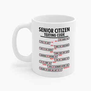 May include: White ceramic mug with a black handle. The mug features the text "SENIOR CITIZEN TEXTING CODE" with a list of texting acronyms and their meanings in black and red text. The mug is a standard size.