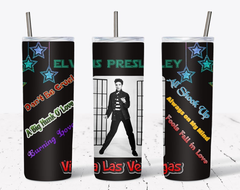 May include: A black tumbler featuring Elvis Presley with song titles and star accents. The tumbler has a black background with the words "Elvis Presley" in green. Song titles include "Don't Be Cruel" and "All Shook Up."