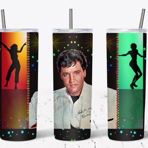 May include: A stainless steel tumbler featuring Elvis Presley with his signature, and silhouettes of dancers. The design includes colorful stars and a vertical border with a string of lights. The tumbler has a silver straw.