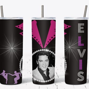 May include: A black tumbler featuring a black and white image of Elvis Presley, with the name "ELVIS" in a rhinestone-like font. The design includes a pink jacket outline and a silhouette of dancers. The tumbler has a silver straw.