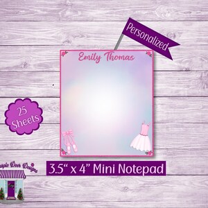 May include: A pink and purple mini notepad with a ballerina theme. The notepad has 25 sheets and measures 3.5 inches by 4 inches. The notepad is personalized with the name "Emily Thomas".