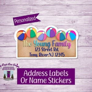 May include: Personalized address label with a beach theme. The label features a row of colorful beach balls on a sandy background. The text "The Young Family" is printed in brown on a beige background, along with the address "123 Street Rd. Toms River, NJ 12345".