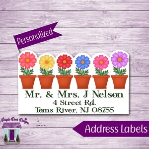 May include: Personalized address label with a row of six potted flowers in pink, yellow, red, blue, pink, and purple. The label includes the text "Mr. & Mrs. J Nelson, 4 Street Rd., Toms River, NJ 08755".