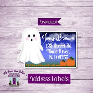 May include: Halloween address labels featuring a white ghost with a blue sky background and orange pumpkins. The text reads "Personalized", "Joey Brown", "123 Street Rd", "Toms River", "NJ 08755", "My Purple Door Designs", and "Address Labels".