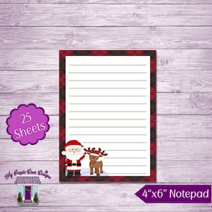 May include: A red and green plaid notepad with a Santa Claus and reindeer illustration. The notepad is 4 inches by 6 inches and has 25 sheets.