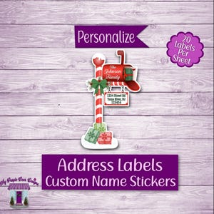 May include: Christmas-themed address labels featuring a red mailbox with a green bow and gifts. The labels are personalized with "The Johnson Family" and address details. The design includes a candy cane post and the text "Address Labels Custom Name Stickers".