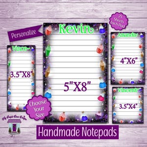 May include: Handmade notepads in various sizes, featuring a purple and black border with potion bottle illustrations. The notepads are personalized with names like Kevin, Amanda, and Vince. Sizes include 3.5"x8", 5"x8", 4"x6", and 3.5"x4".
