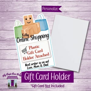 May include: A gift card holder with a shopping theme. The design includes illustrations of shopping bags and boxes, with the text "Kelly Online Shopping." It also says "Plastic Gift Card Holder Attached" and "Gift Card Not Included."