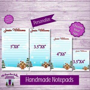 May include: Four different sizes of personalized notepad paper with a winter scene. The notepads are 5x8 inches, 3.5x8 inches, 4x6 inches, and 3.5x4 inches. The notepads are blue with a gingerbread house and snowmen.
