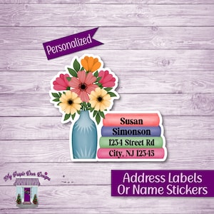 May include: Personalized address labels or name stickers with a floral design. The labels feature a vase with flowers and the text "Susan Simonson, 1234 Street Rd, City, NJ 12345".