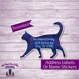 May include: Personalized address labels or name stickers featuring a galaxy-themed cat silhouette. The text reads "The Adams Family, 1234 Street Rd., City, NJ 12345".