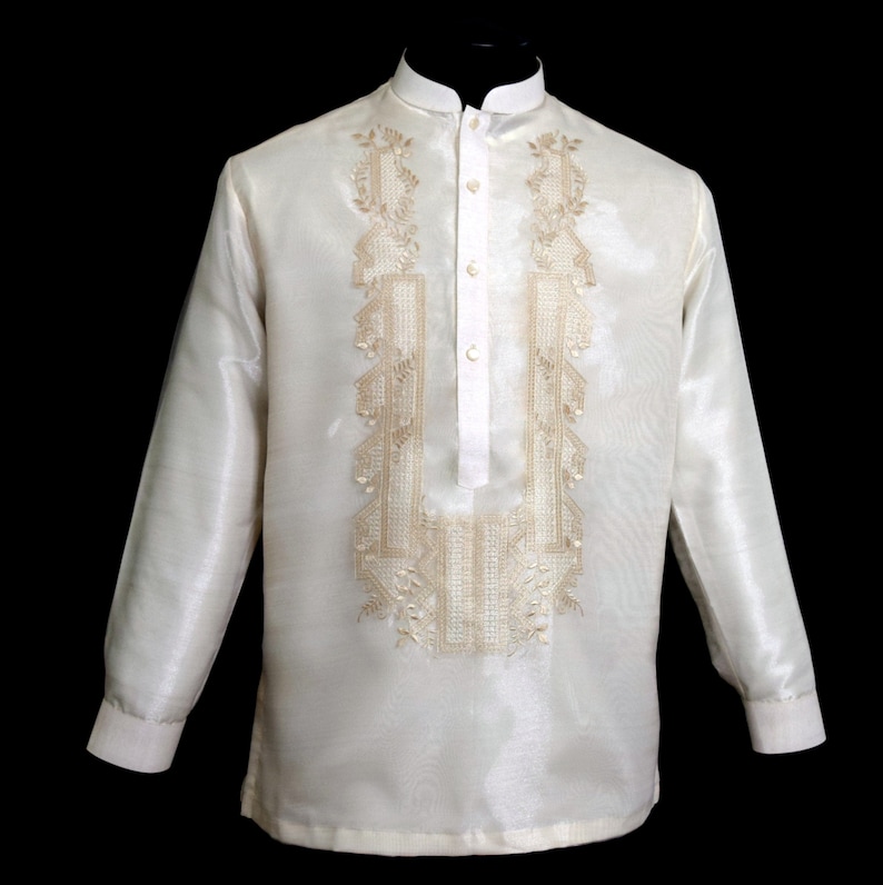Timeless Elegance in Beige: Hand-embroidered on rich Organza fabric, it features a Chinese collar, cuff buttons and comes with an attached lining for added comfort. A symbol of tradition and sophistication for any special occasion.