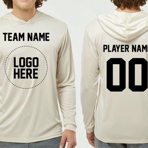 a man wearing a hoodie with the name and number on it