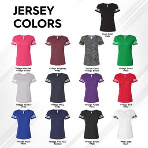 a collection of various colored women's t-shirts, including pink, burgundy, camo, green, and red.