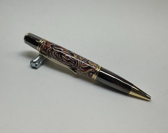 Bolígrafo Gatsby Grande Twist en oro y metal de cañón