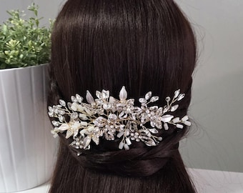 A chic hairpin with golden flowers encrusted with sparkling rhinestones and branches of opal beads.