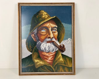 Vintage embroidery wood framed portrait of pipe-smoking fisherman, mid century wall art 1970’s, Original by Harry Haerendel