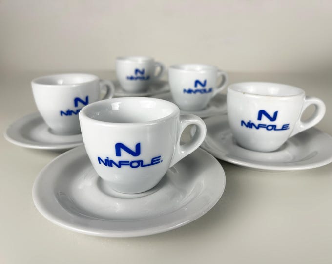 Set of 4 or 5 heavy porcelain Ancap bar quality espresso cups and saucers advertising the Italian Ninfole coffee company.
