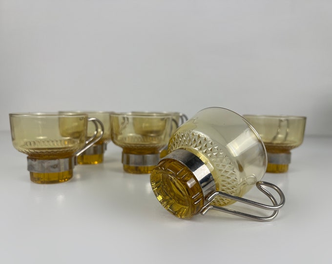 Set of 6 small but stylish amber colored glass tea or coffee cups with a metal handle, France 1960s