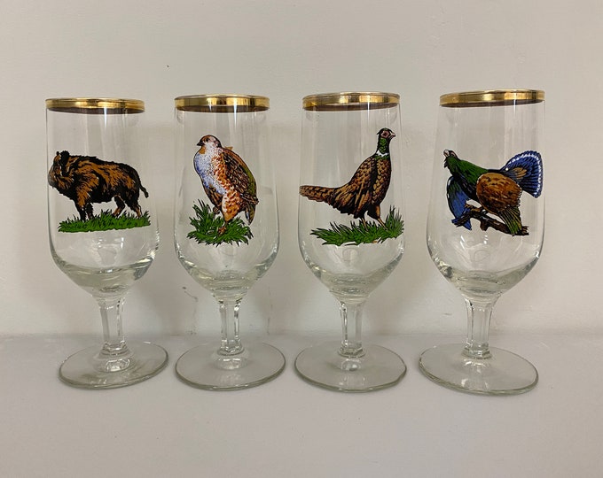 Vintage stemmed aperitif glasses, liqueur glasses with a print of different predators and a golden trim, mid century modern barware 1970’s