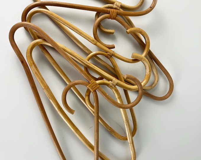 Set of 4 or 5 vintage bamboo and rattan clothes hangers from the 1980s