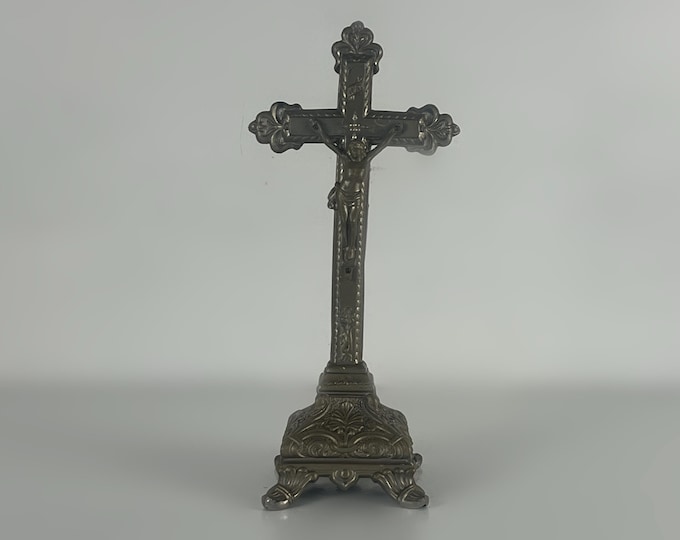 Antique catholic metal altar or table crucifix, religious decor from the early 1900s
