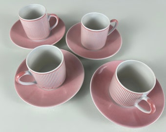 Vintage set of 3 or 4 porcelain demitasse coffee cups and saucers, white base with pink decorations, manufactured in Italy 1980s