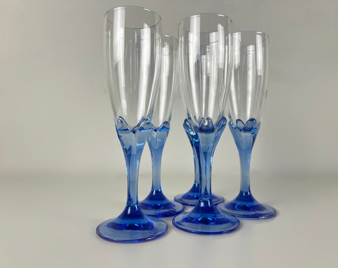 Sets of gorgeous Bormioli Bouquet vintage champagne glasses, flower chalice and blue graceful stem, Italy 1980s