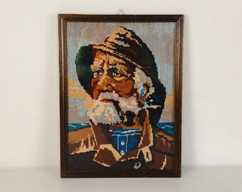 Vintage embroidery framed portrait of Dorus Rijkers, a pipe-smoking fisherman, mid century wall art 1970’s, Original by Harry Haerendel