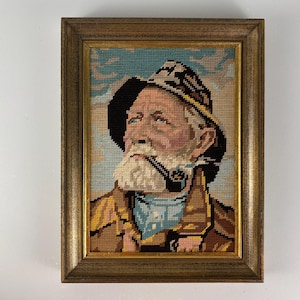 Vintage embroidery framed portrait of Dorus Rijkers, a pipe-smoking fisherman, mid century wall art 1970’s, Original by Harry Haerendel