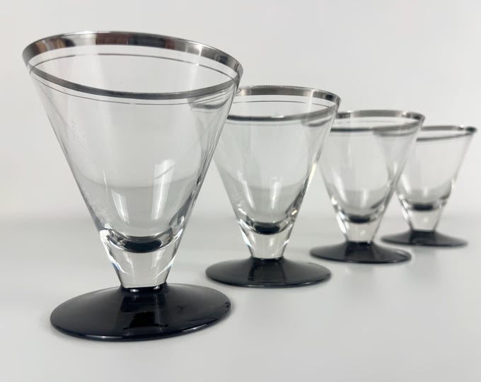 Set of 3 or 4 small Art Deco wine glasses, clear glass chalice, silver rim and black glass base, manufactured by V.D. Belgium 1930s