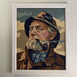 Vintage embroidery framed portrait of Dorus Rijkers, a pipe-smoking fisherman, mid century wall art 1970’s, Original by Harry Haerendel