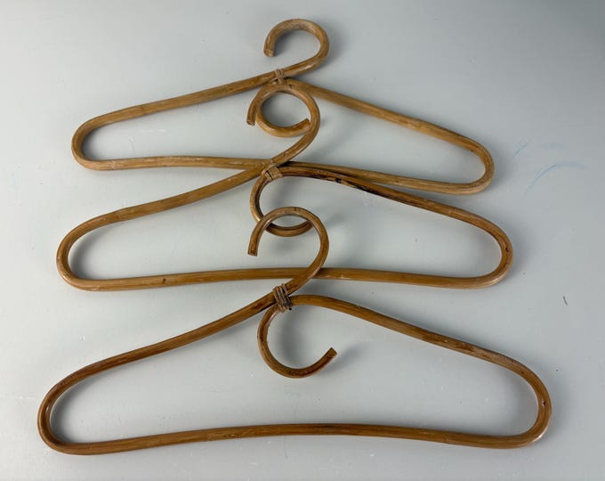 Set of 3 vintage rattan and bamboo clothes hangers from the 1970s