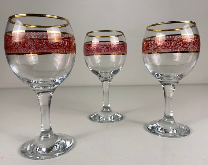 3 vintage wine glasses decorated with a pink shade band and golden rims, beautiful vintage barware