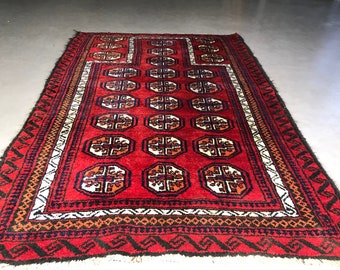 Oriental rug, small carpet, hand knotted made of wool, (burgundy) red, beige, orange and black accents, 1960s Mid century modern style.