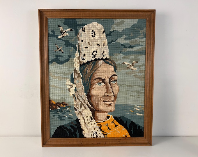 Very nice vintage wood framed embroidery portrait of a French woman, especially a Breton woman needlepoint, mcm wall art from the 1970s.