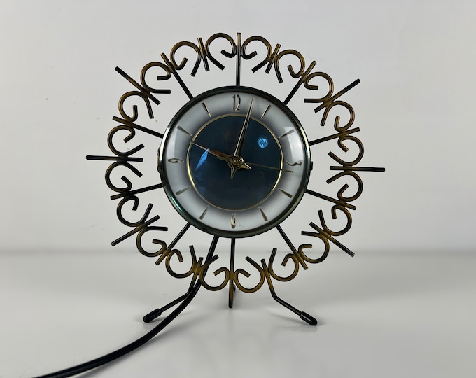 Beautiful electric metal table clock, mantle clock, Dutch design by NUFA, mid century modern from the 1950s