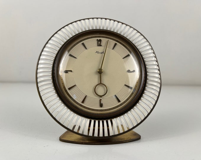 Art Deco mantle clock, art deco table clock by Heinrich Möller for Kienzle "The Sun”, Germany from the 1930s